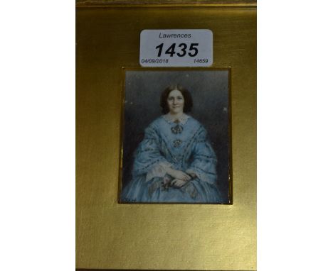 19th Century watercolour portrait miniature of a lady wearing a blue dress, signed with initials R.C.W.