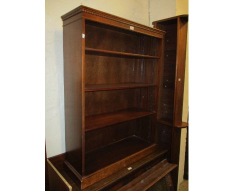 Reproduction mahogany four shelf open bookcase with a plinth base