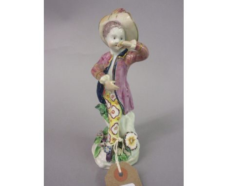 18th Century bow type figure of a boy dancer wearing a wide brimmed hat and floral breeches, 6.75ins high (restorations)