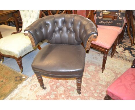 Victorian button leather upholstered tub shaped office / library chair, the horseshoe back above an overstuffed seat and turn