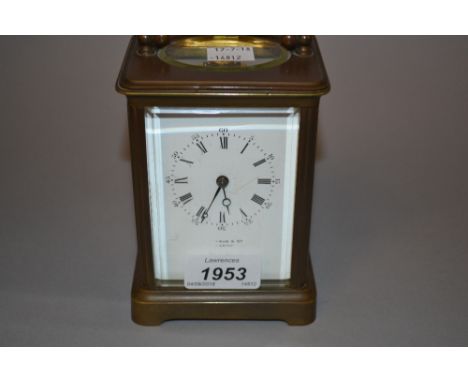 Late 19th / early 20th Century brass cased carriage clock, the enamel dial with Arabic and Roman numerals, indistinctly signe