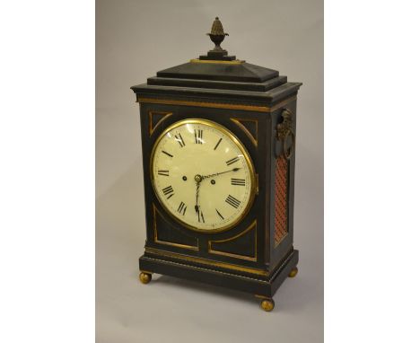 Regency ebonised and gilt brass mounted bracket clock the rectangular case with pineapple finial and a stepped surmount, ring