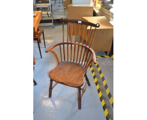 18th / 19th Century yew and elm Windsor chair, the comb back with shaped top rail above carved panel seat, turned supports an