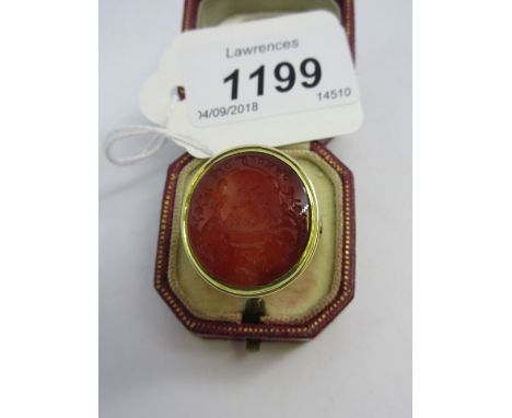 Large antique yellow metal cornelian intaglio seal ring carved with a lion passant CONDITION REPORT Signs of general wear but