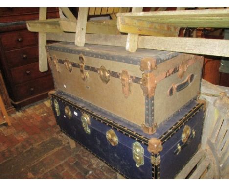 Early 20th Century brown travel trunk with original travel label and a blue canvas covered travel trunk by Overpond