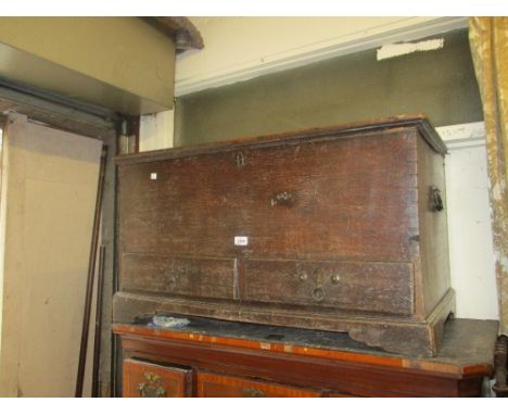 18th Century oak trunk with a hinged lid above two drawers raised on bracket feet