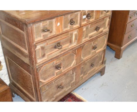 Early 18th Century oak two part moulded front chest of two short and three long graduated drawers with steel handles, raised 