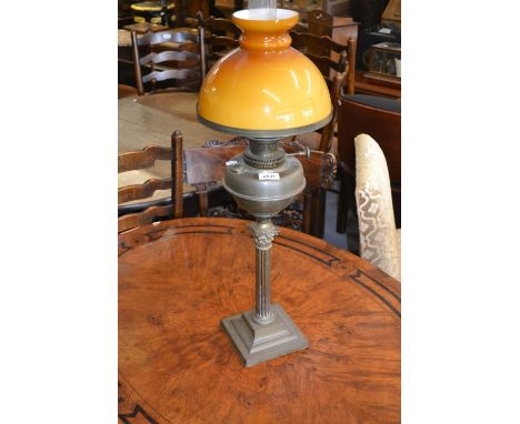 20th Century brass Corinthian column oil lamp with brass well and yellow glass shade (at fault)