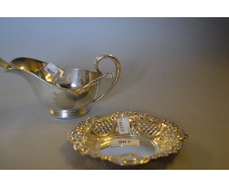 Oval London silver pierced trinket dish together with a silver spoon, three plated spoons and a plated sauce boat