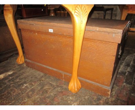 19th Century pine trunk with original painted finish, the hinged cover enclosing a candle box with concealed drawers