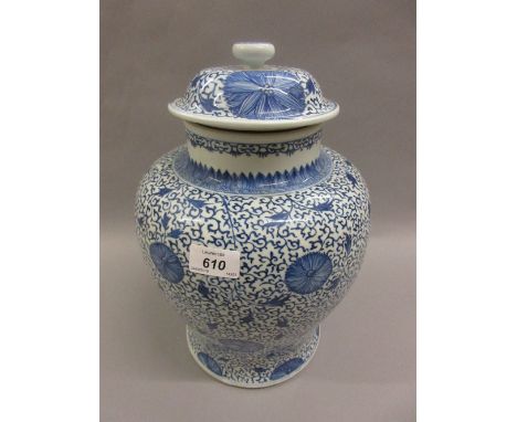 Chinese Kangxi blue and white temple jar and cover, decorated with an all-over floral design, marked to the base with a paint