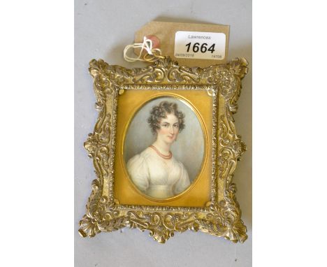 Watercolour portrait miniature of a lady wearing coral earrings and necklace, inscribed verso ' Painted at Worcester by J.T. 