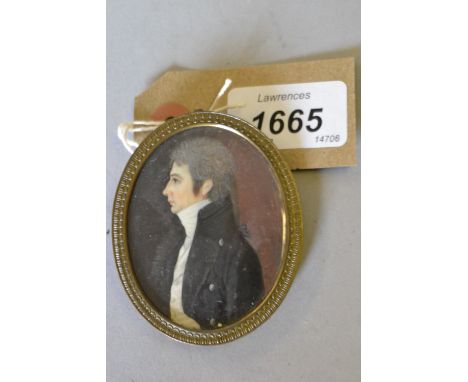 19th Century watercolour portrait miniature of a gentleman in profile, in an oval gilt brass frame, 2.25ins x 1.75ins 
