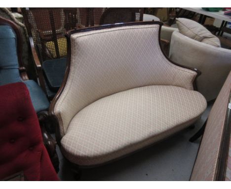 Edwardian mahogany and line inlaid sofa with a concave upholstered back and an upholstered seat, raised on scroll front suppo