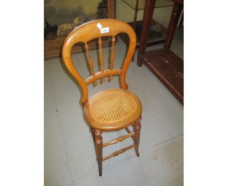 Child's 19th Century fruitwood correction chair with bobbin turned back, cane seat and turned supports with stretchers