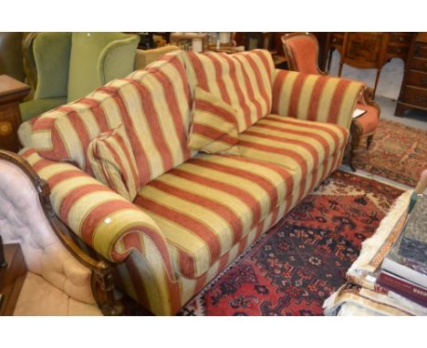 Modern upholstered Duresta three seater sofa raised on turned mahogany supports with brass casters