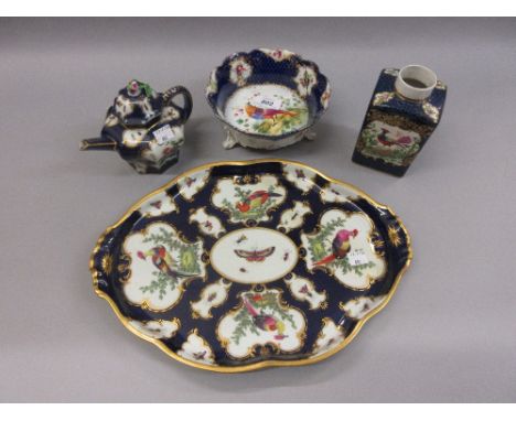 Continental porcelain tray decorated with panels of exotic birds on a blue scale ground, a similar teapot, square shaped jar 