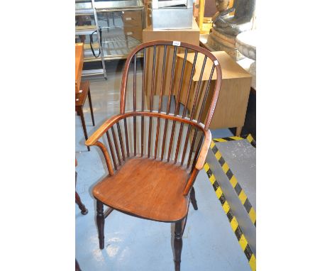 19th Century yew and elm Windsor chair, the hoop and stick back above a carved panel seat and turned supports with stretchers