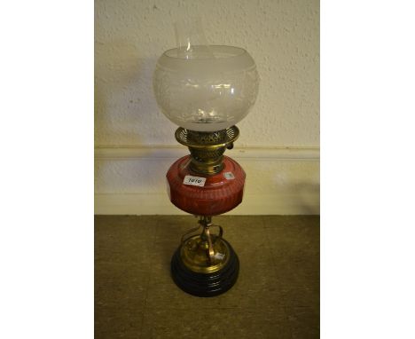 19th Century brass and cranberry glass oil lamp with etched glass shade, copper warming pan and an antique lead tobacco box w