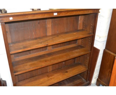 Edwardian mahogany four shelf open bookcase with moulded top and plinth base