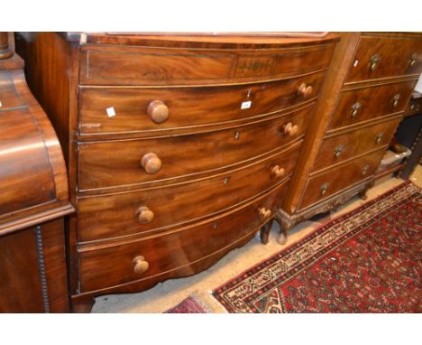 Regency mahogany satinwood crossbanded and brass inlaid bow fronted chest of five graduated drawers with knob handles and spl