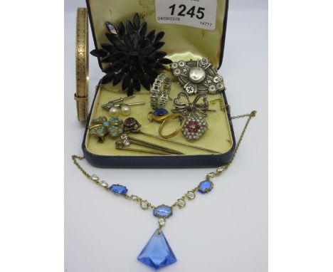 Blue jewellery box containing a small quantity of various vintage jewellery including stick pins, brooches, bracelet etc.