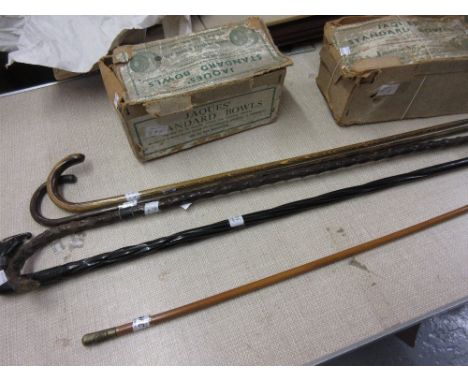 Manchester Regiment swagger stick, four various walking canes together with two boxed pairs of Jaques wooden green bowls