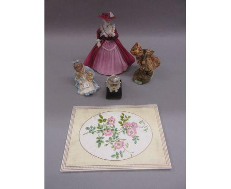 Unusual Wedgwood figure of a girl with a spinning top (at fault), porcelain figure of a seated dog with ruff collar, Royal Wo