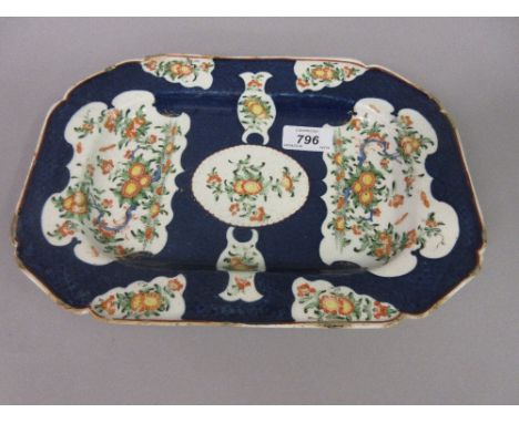 Worcester Miles Mason irregular octagonal dish decorated with panels of exotic flowers on a blue scale ground, 11.5ins wide (