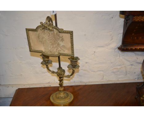19th Century French ormolu twin branch candlestick with adjustable screen labelled ' Presented by Her Majesty Queen Mary to t