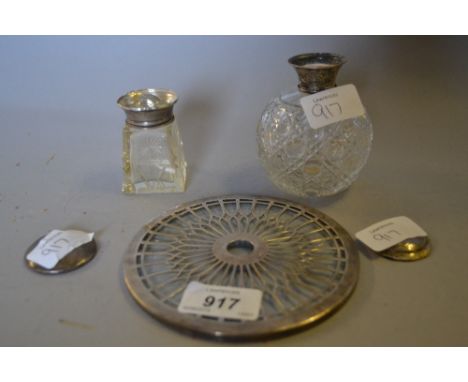 Silver topped cut glass perfume bottle (at fault), another smaller perfume bottle (at fault) and a silver covered glass teapo