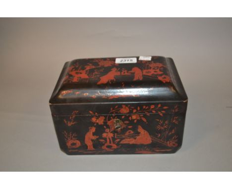 19th Century black lacquer red chinoiserie decorated tea caddy with pewter lined interior