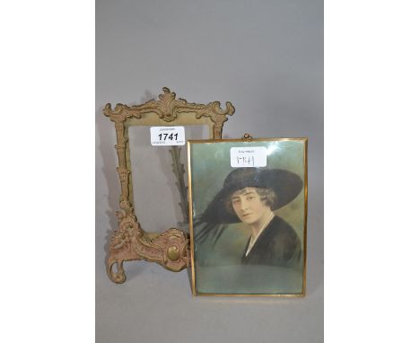 Ornate brass photograph frame with folding easel, together with brass framed portrait print