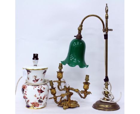 A BRASS ADJUSTABLE DESK LAMP with a green glass shade, 56cm in height, a gilt metal three branch light fitting and a Coalport