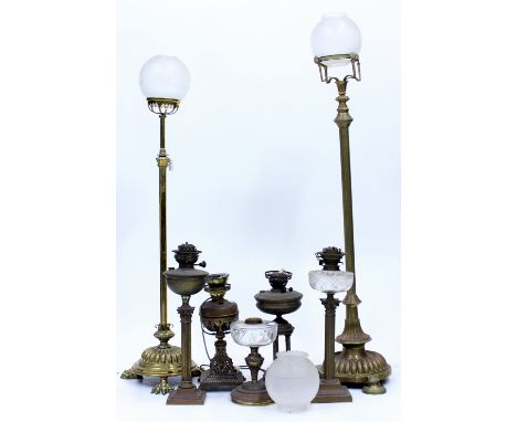 A 19TH CENTURY BRASS ADJUSTABLE STANDARD LAMP of reeded column form 128cm in height, a further 19th century brass adjustable 