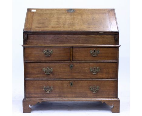 A GEORGE III OAK BUREAU with fall front, standing on shaped bracket feet, 91cm x 103cm x 51cm