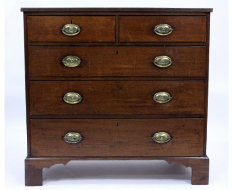A 19TH CENTURY MAHOGANY CHEST of two short and three long drawers with brass handles and bracket feet