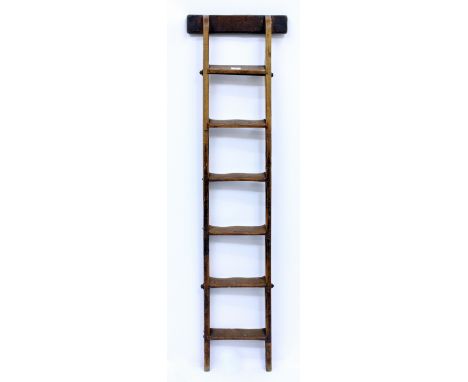 A 19TH CENTURY ELM LIBRARY LADDER  with a leather upholstered support and six steps 148cm in length 