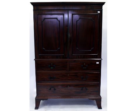 A 19TH CENTURY MAHOGANY LINEN PRES of small proportions and two cupboard doors above two short and two long drawers raised on