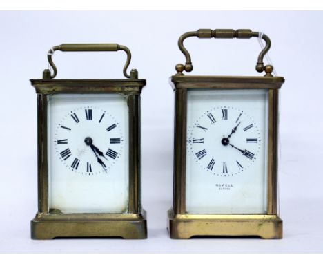 AN OLD BRASS CASED CARRIAGE CLOCK or timepiece, the dial signed Rowell of Oxford 14.5cm high with the handle up, complete wit