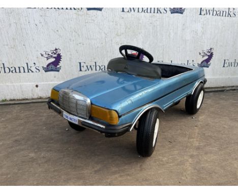 Vintage Young Master Mercedes-Benz 500 SEL metal pedal car finished in blue with white wheels. Please note this lot has the s
