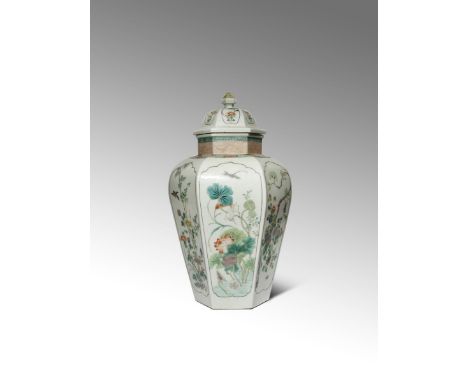A CHINESE FAMILLE VERTE HEXAGONAL-SECTION BALUSTER VASE AND COVER 19TH CENTURY Each facet painted with a panel enclosing lotu