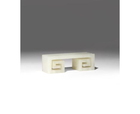 A CHINESE PALE CELADON JADE BRUSH REST 19TH CENTURY Carved in the form of key fret with two scrolled ends, the rectangular to