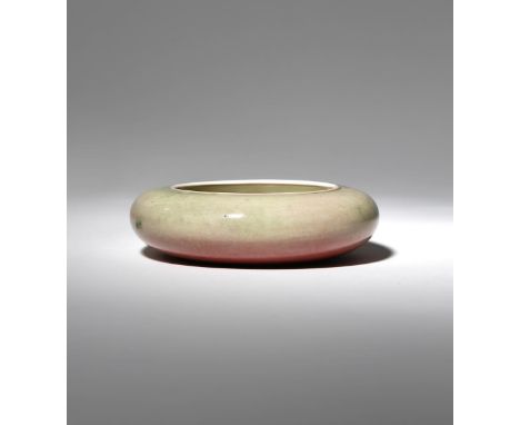 A CHINESE PEACHBLOOM GLAZED BRUSH WASHER 19TH CENTURY The compressed circular body decorated with green and peach-coloured mo