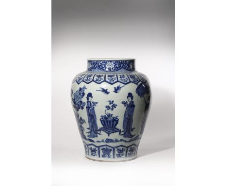 A LARGE CHINESE BLUE AND WHITE BALUSTER VASE KANGXI 1662-1722 Painted with ladies holding flowers and parasols in a garden as