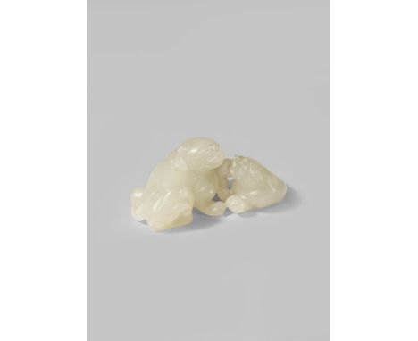 A SMALL CHINESE PALE CELADON JADE CARVING OF TWO LION DOGS QING DYNASTY OR LATER Carved as a reclining mother and a cub facin