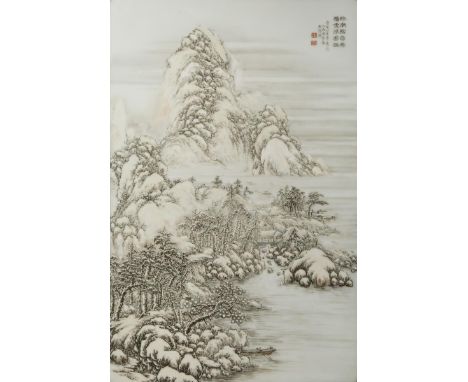 A CHINESE ENAMELLED PORCELAIN 'WINTER LANDSCAPE' PLAQUE 20TH CENTURY Painted with a snowy mountain scene, detailed with a hou