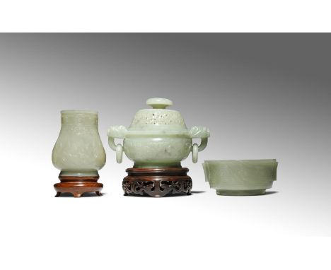 THREE CHINESE PALE CELADON JADE ITEMS QING DYNASTY Comprising: a small vase carved with archaistic mythical birds beneath sho