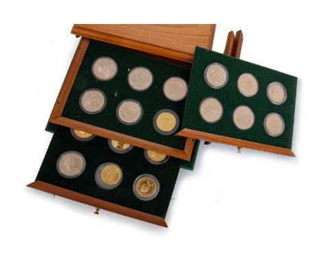 CASED COLLECTION OF GOLD AND SILVER COINS, from around the world, including examples from Indonesia, America and other countr