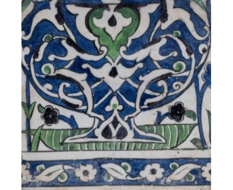 Islamic Art. A Damascus tile painted with arabesque over blue ground  Ottoman Empire, 17th-18th century . Provenance: ex Hadd